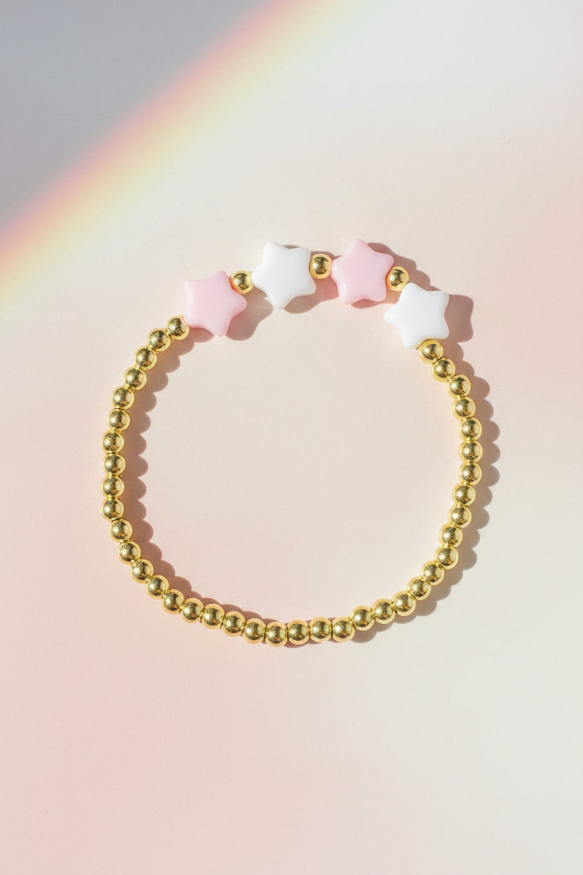 Bracelet with star-shaped beads on a beige background
